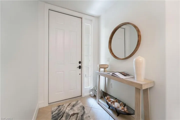 Entryway featuring light tile patterned flooring