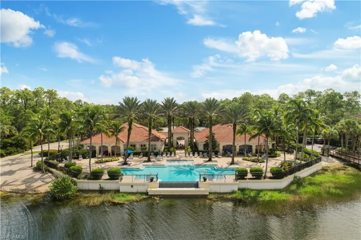 View of pool with a patio and a water view