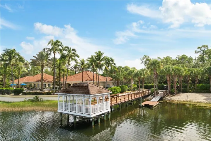 View of dock featuring a gazebo and a water view