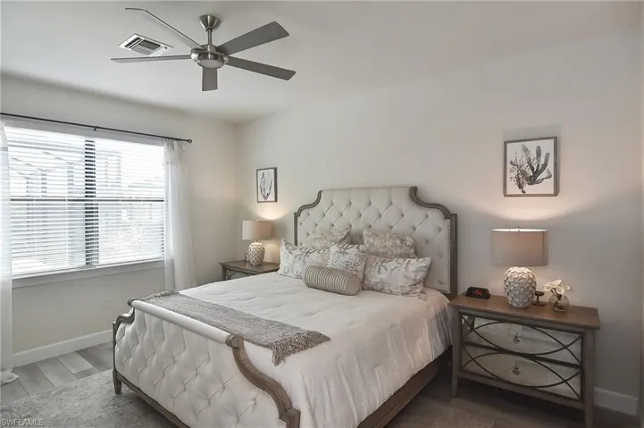 Bedroom with wood finished floors and ceiling fan