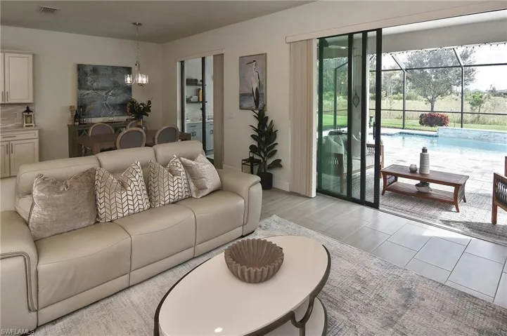 Living room featuring wood finish floors and a chandelier