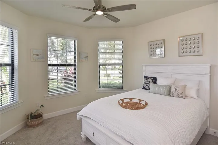 Bedroom featuring carpet and a ceiling fan