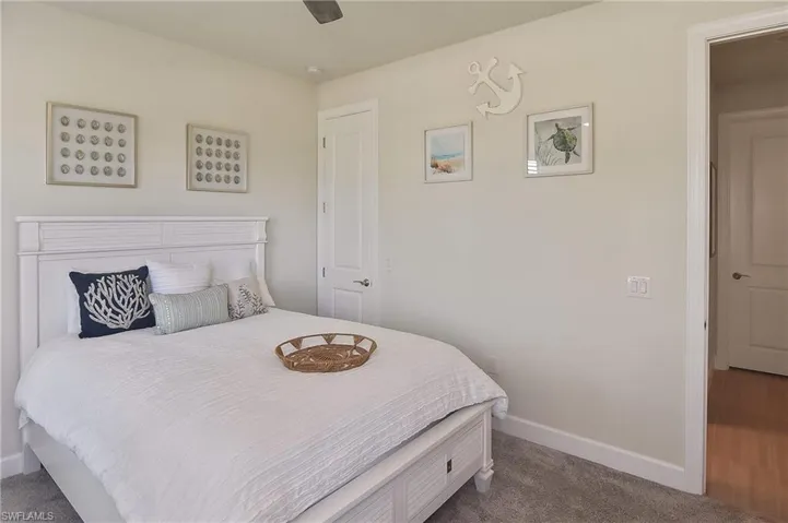Bedroom featuring carpet and ceiling fan