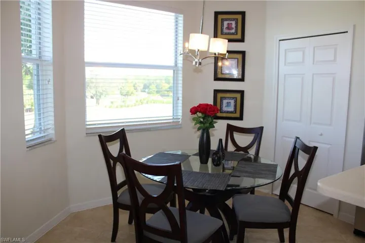 Dining room featuring a chandelier and light tile patterned floors
