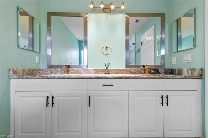 Bathroom featuring double vanity