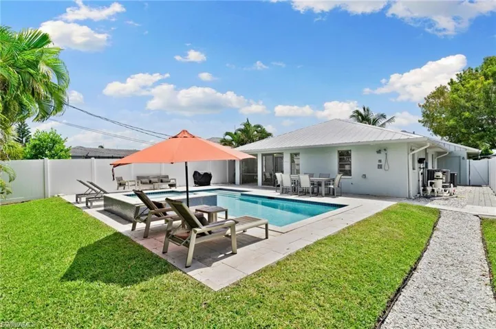 View of swimming pool with a patio area, a fenced backyard, outdoor dining space, and outdoor lounge area