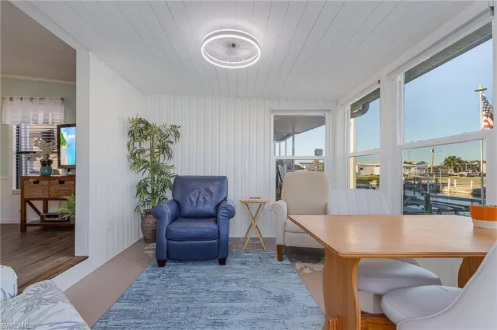 Office area featuring concrete flooring and wooden ceiling