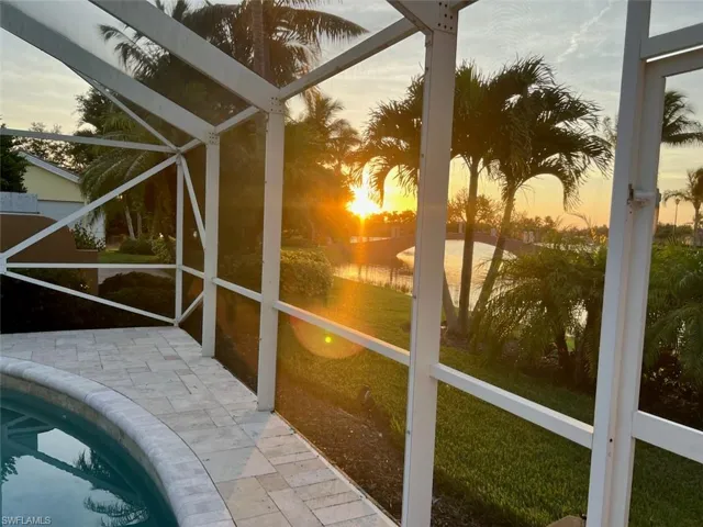 Pool at dusk with a lawn