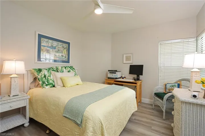 Bedroom featuring hardwood / wood-style flooring and ceiling fan