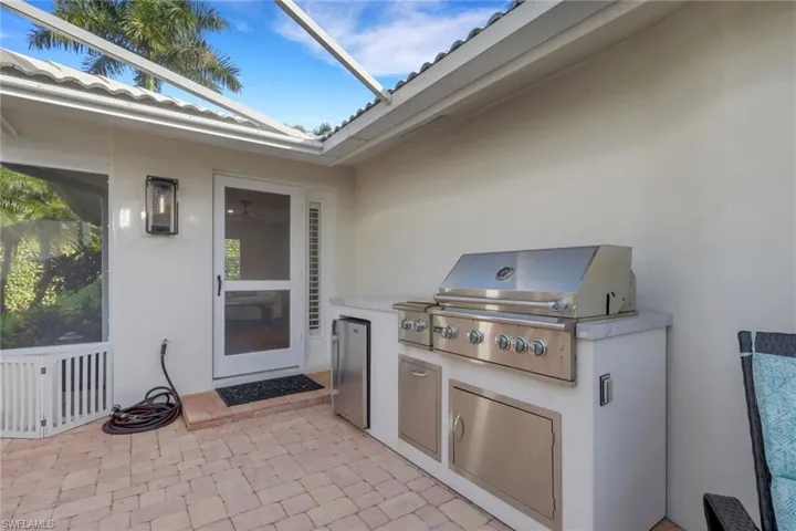 View of patio featuring exterior kitchen