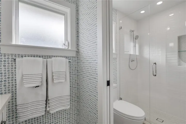 Full bath featuring a shower stall and recessed lighting