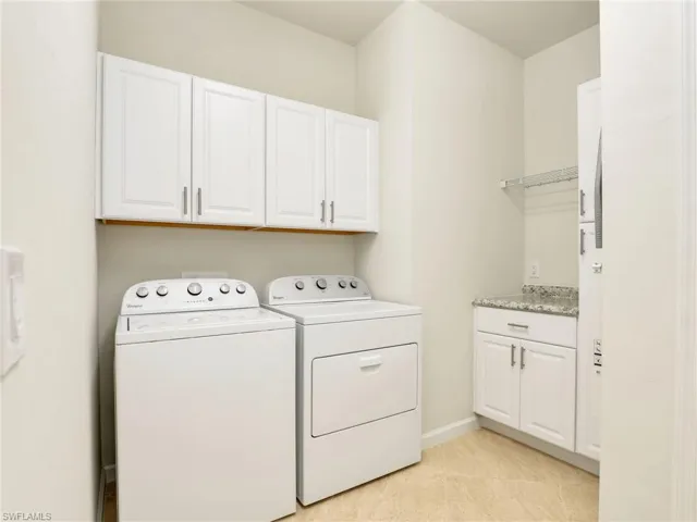 Spacious Laundry with Overhead Cabinet Storage