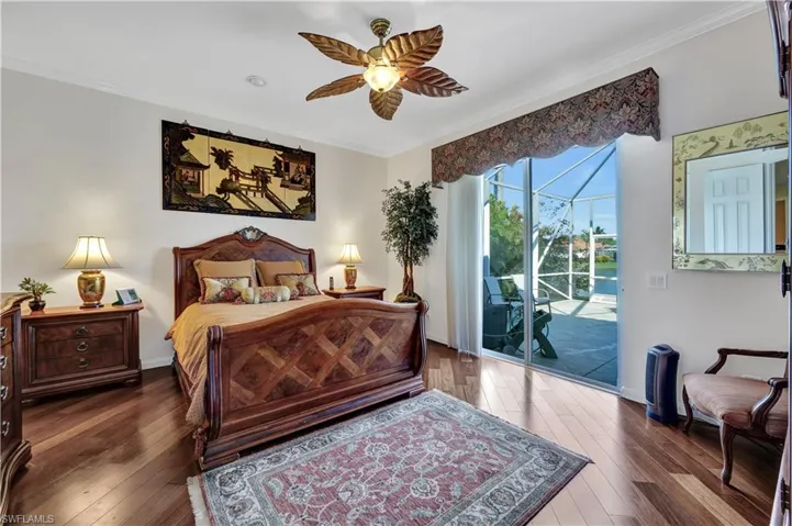 Primary Bedroom with Wood Flooring