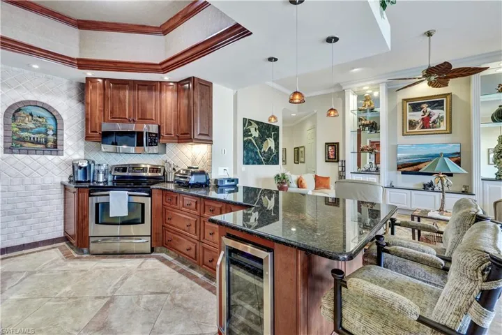 Kitchen with SS appliances and wine cooler