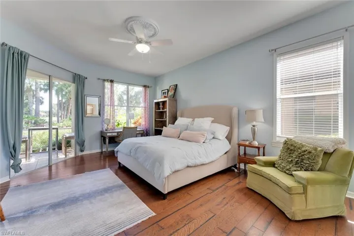 Master Bedroom with wood flooring and access to lanai