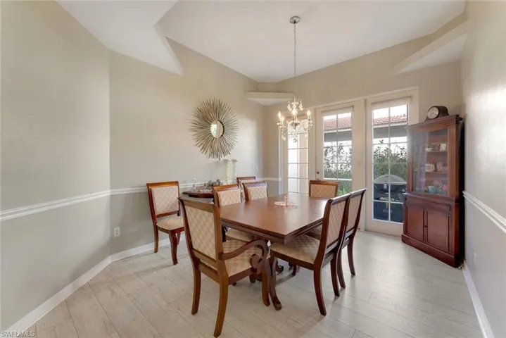 Dining space featuring light hardwood / wood-style floors and a chandelier