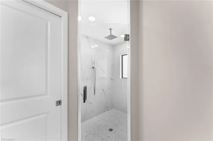 Bathroom featuring tiled shower