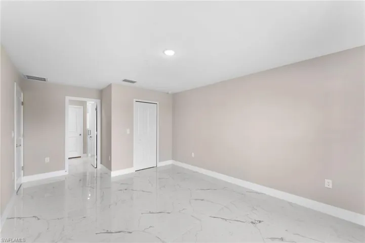Spare room with light tile patterned floors