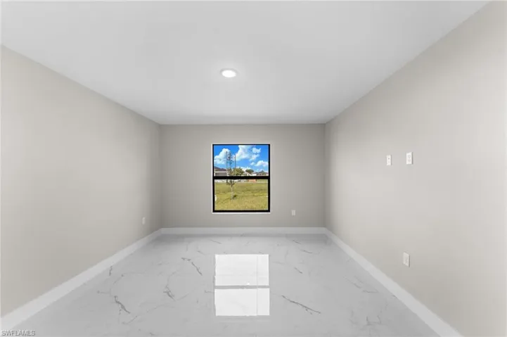 Unfurnished room featuring tile patterned floors