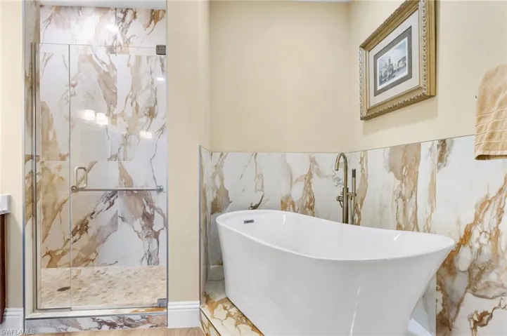 Your primary bath has a free standing tub for relaxation after a long day at the beach, work or a round of golf!