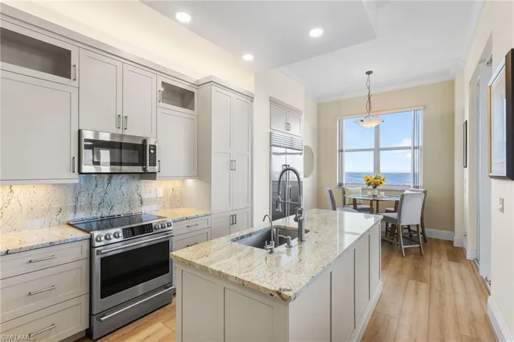 High end appliances including a SUB ZERO refrigerator, Bosch dishwasher and a GE Cafe' induction cooktop.Spectacular granite countertops and granite backsplash make a stunning statement in this remodel.