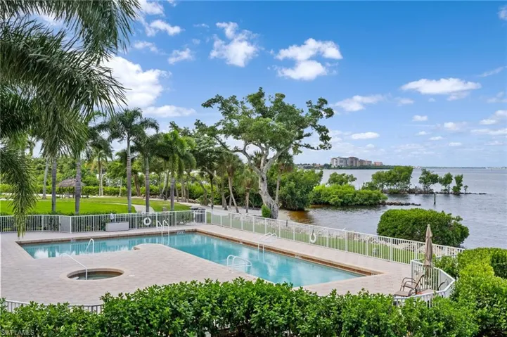 Relax in the community pool with river views, a patio area, and a hot tub! As you relax here you can watch the boats coming in and out of the marina! A perfect spot anytime of the day!