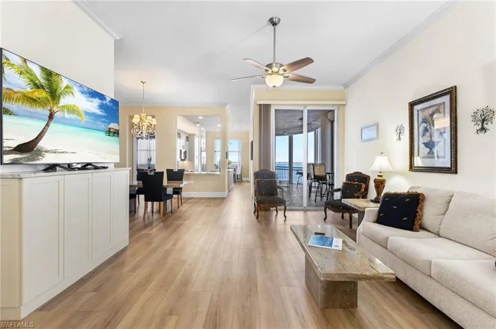 The open concept and the 11 ft ceilings give this condo a larger feel. Luxury vinyl waterproof flooring throughout the main living area. 8 ft glass sliders and lots of windows bring in massive amounts of natural light.