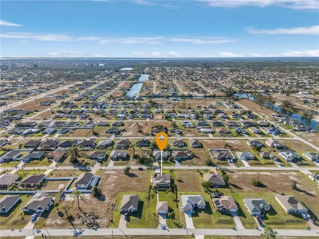 View of property location with nearby suburban area