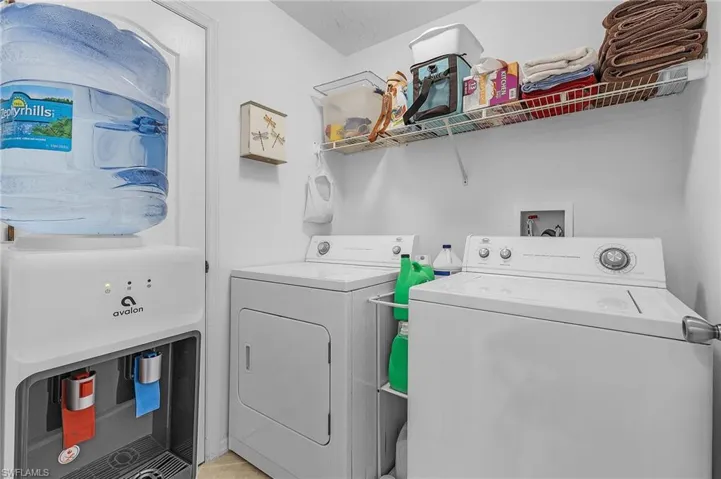 Laundry room featuring independent washer and dryer