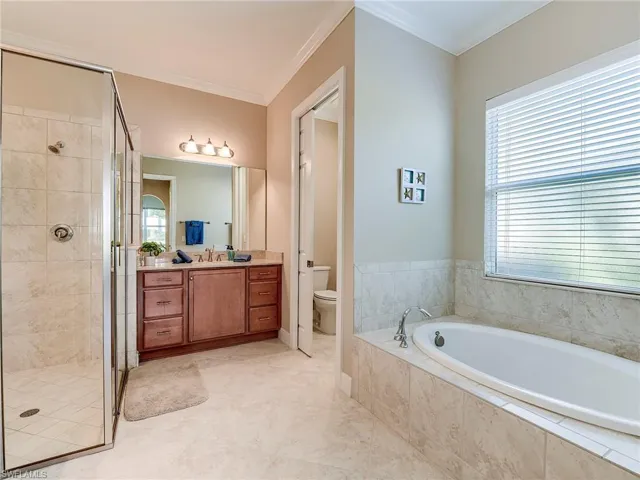 You get it all - 2 sinks, large shower, soaking tub, and private commode room