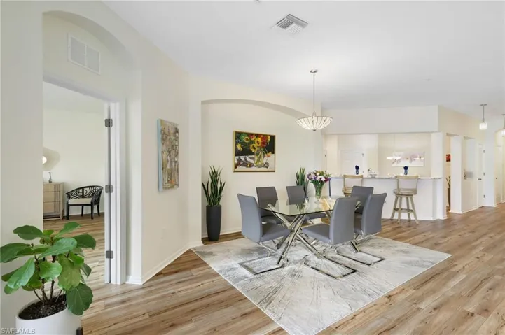 Dining area with light wood-type flooring and baseboards