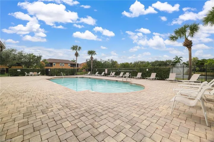 Community pool featuring a patio area