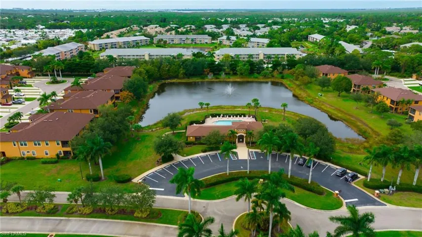 Aerial view of property and surrounding area featuring a nearby body of water