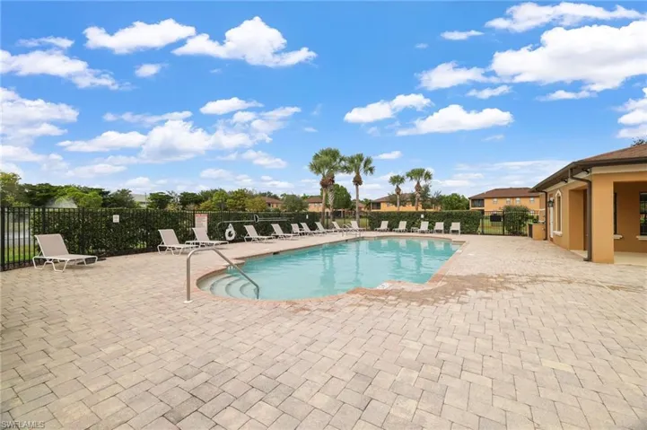 Community pool with a patio