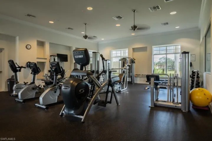 Gym with ornamental molding and visible vents