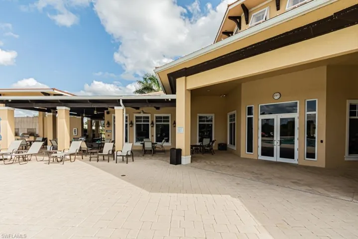 Rear view of property with stucco siding, a patio, and french doors