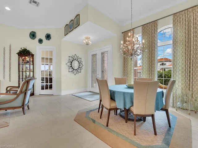 Dining room featuring a chandelier and french doors