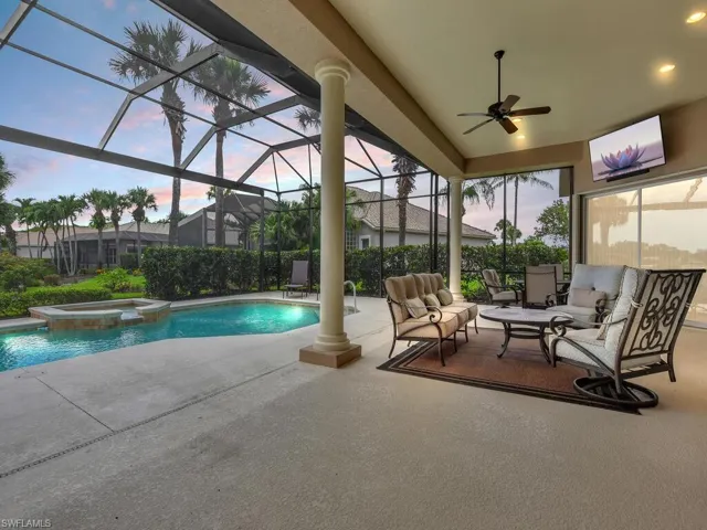 View of swimming pool with an outdoor hangout area, a patio area, ceiling fan, and a lanai