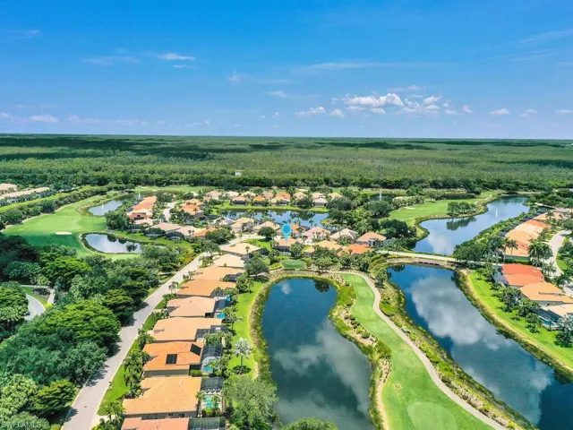 View of property location with nearby suburban area and a nearby body of water