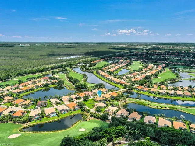 Aerial view of property's location featuring nearby suburban area and a golf club