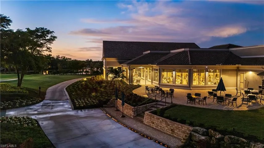 Rear view of property with a patio area and a yard