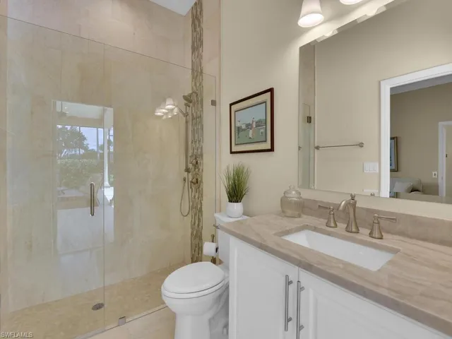 Bathroom with vanity and a stall shower
