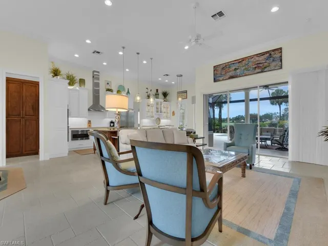 Living area featuring a ceiling fan and recessed lighting