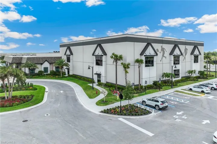 View of property with uncovered parking