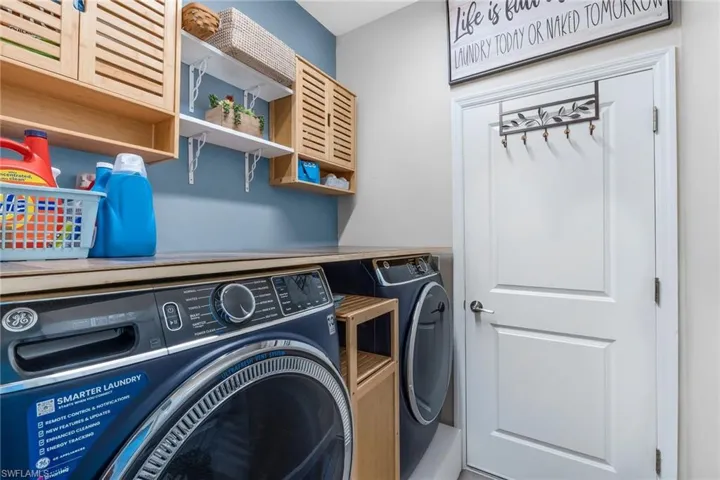 Laundry room featuring washer and dryer and laundry area
