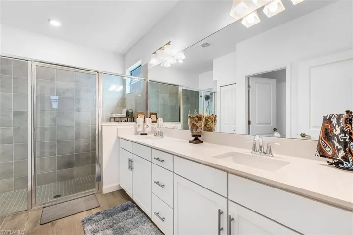 Bathroom with a sink and a shower stall