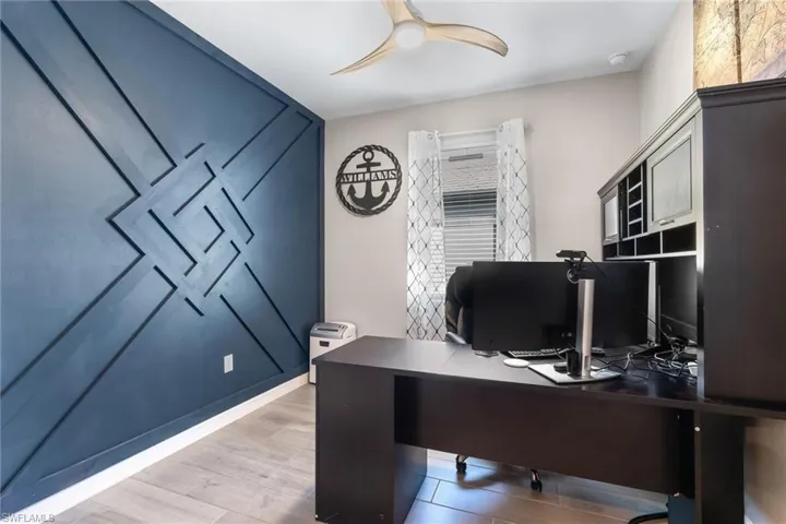 Office featuring a ceiling fan and light wood-style floors