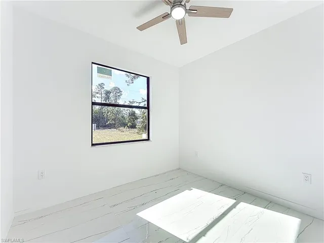 Empty room with a ceiling fan