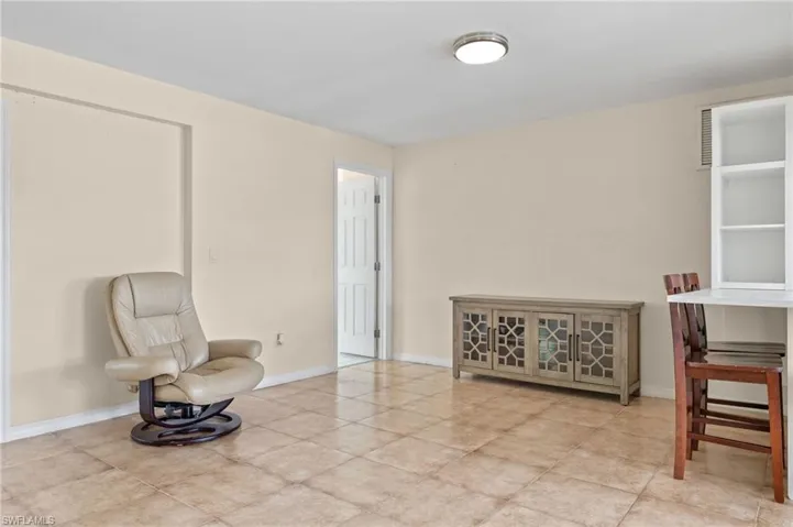 Living area featuring light tile patterned floors