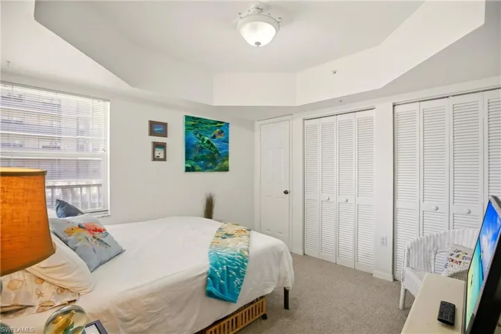 The corner guest room features a trey ceiling and 2 closets